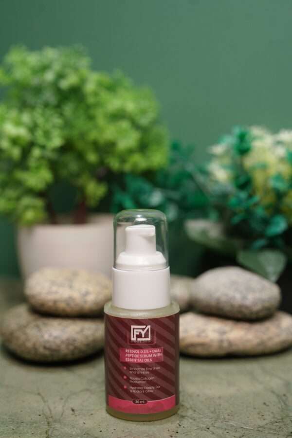 Youth Retinol 0.5% + Dual Peptide Serum bottle with essential oils